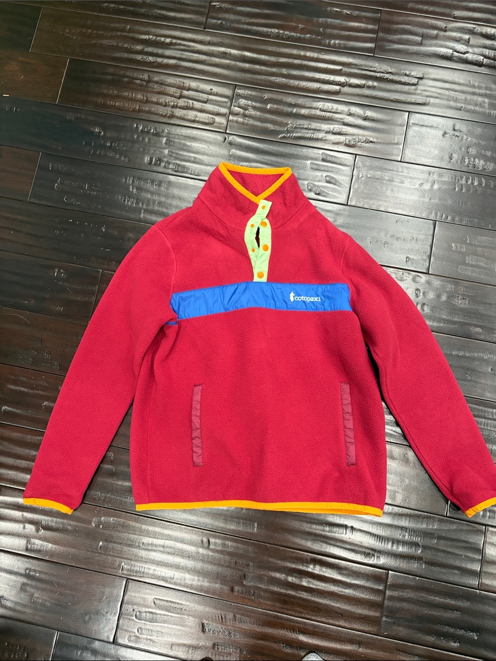 cotopaxi Red Fleece Pullover with Blue Chest Band and Yellow Trim